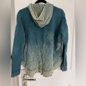 Ombré hoodie longer in the back and shorter in the front. Fits a bit bigger